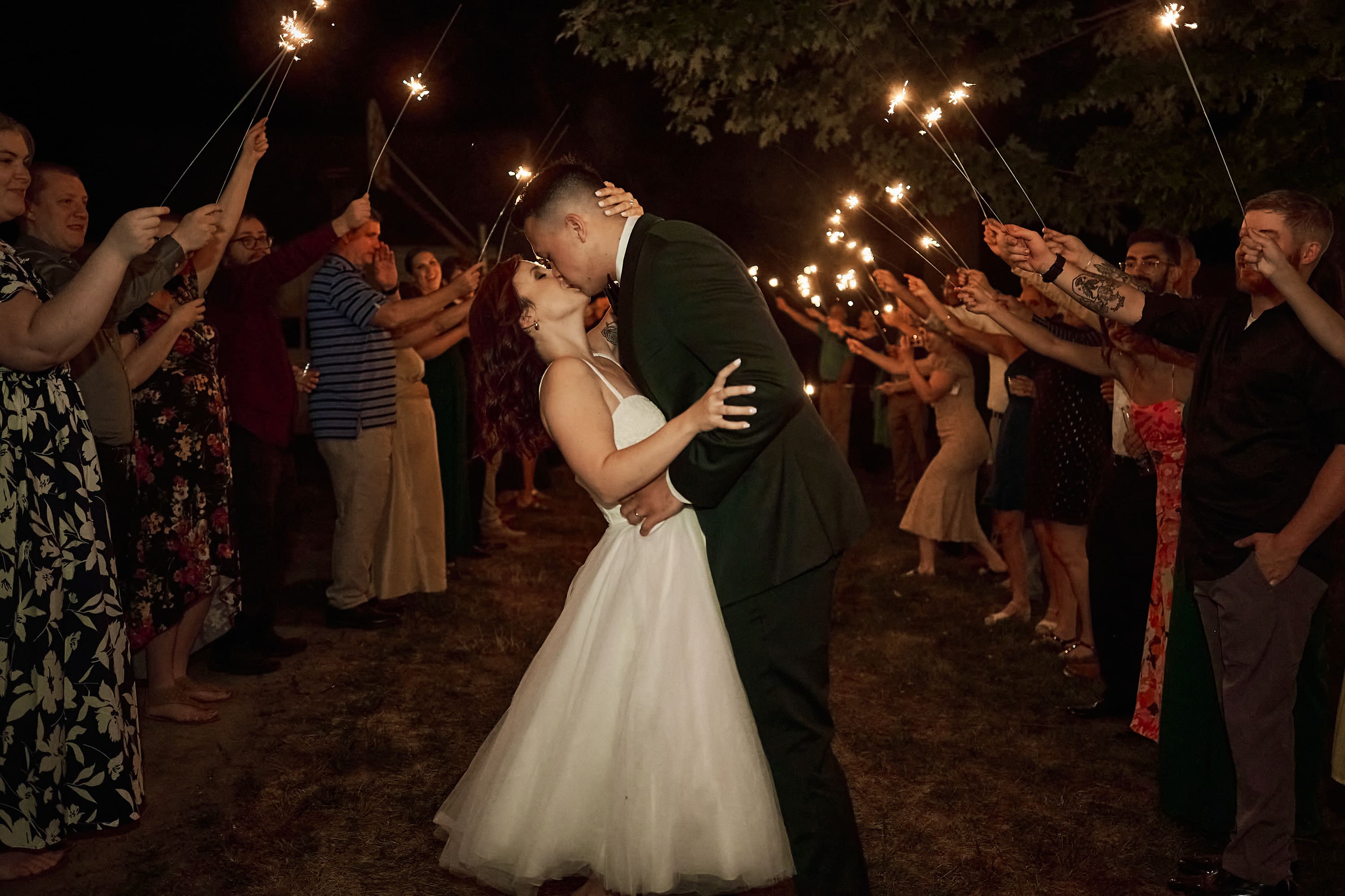 Sparkler send off for a couple at a nighttime Massachusetts wedding